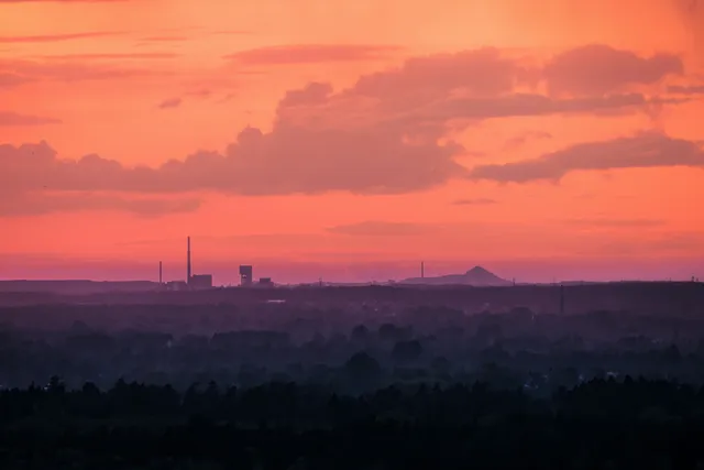 Caroline Skyline wallpaper: coral industrial haze